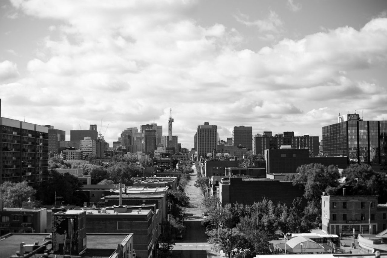 grayscale-montreal-city-skyline-picture-taken-from-bridge-4574432