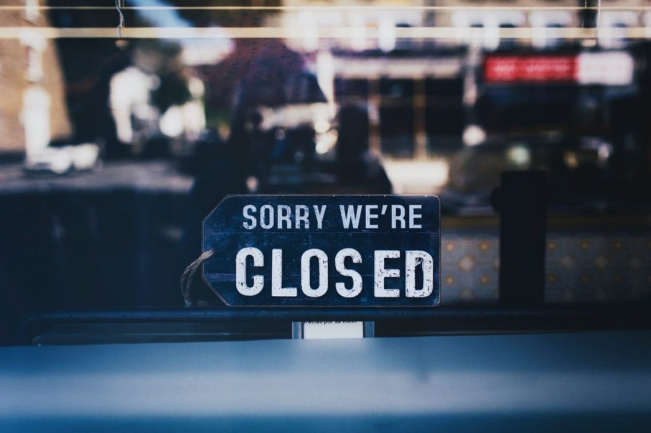close-up-photo-of-sorry-we-re-closed-sign-on-glass-window-2467649/