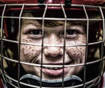 hockey-helmet-face-shot-of-young-boy