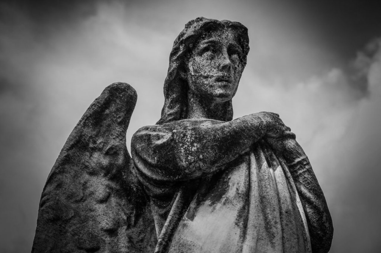 black-white-photo-of-stone-angel-statue-taken-with-a-red-filter