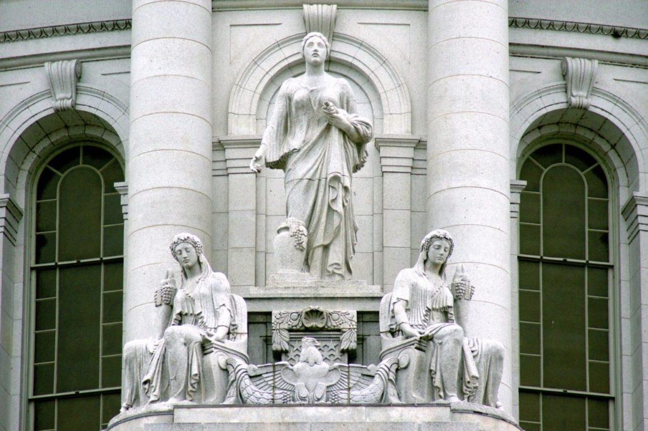 prosperity-and-abundance-statues-outside-building-3515237_1280