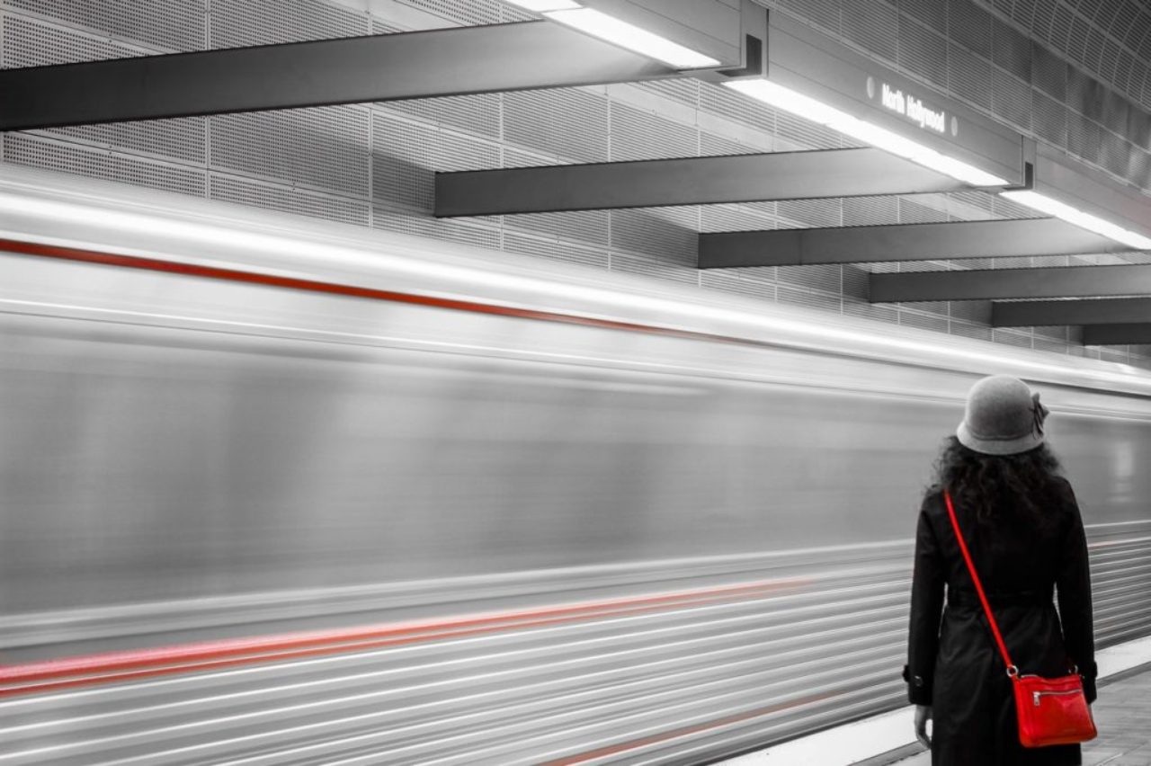 woman-wearing-black-coat-red-purse